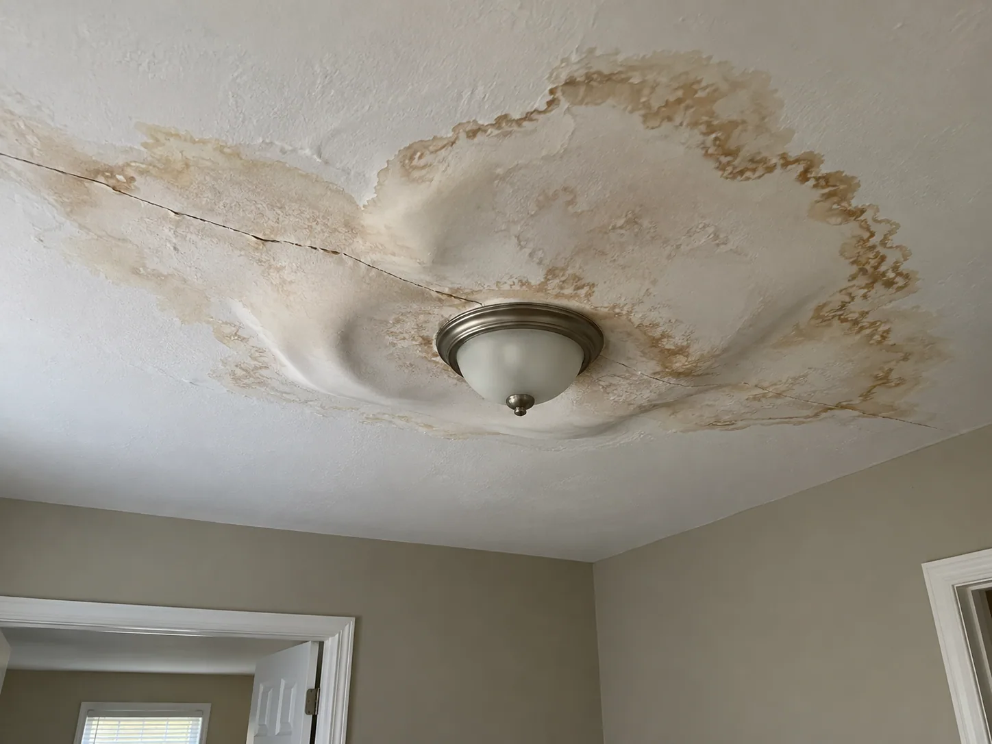 Damp ceiling where mould has started to form in a Houston home